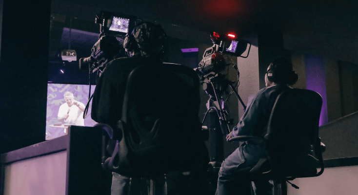 Free Life Chapel volunteers running cameras during a service
